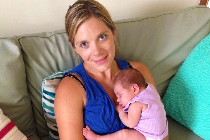 Tara Costigan holding her baby daughter.