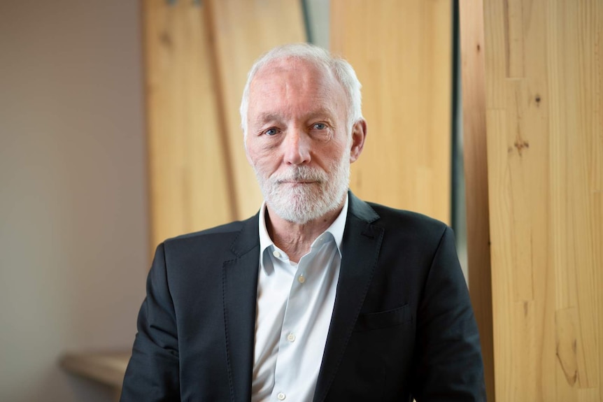 A man, Dr Patrick McGorry, pictured in a suit.