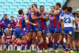 The Knights celebrate a try in the elimination final against the Bulldogs in September 2013.