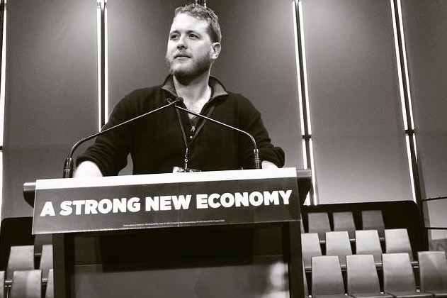 Jack Walker, a staffer for Christopher Pyne, stands at a SA Liberal Team lectern.