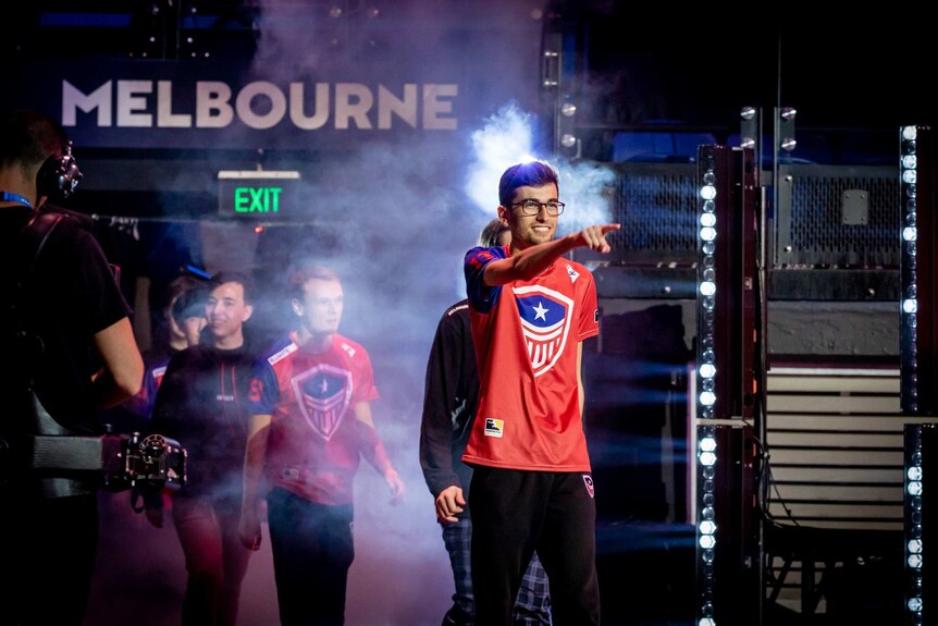 Overwatch players from the Washington Justice team walking onto the stage in Rod Laver Arena