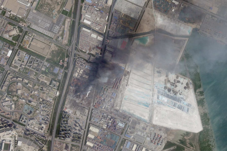 A satellite image shows damage from two massive blasts that ripped through an industrial area of the Chinese port city of Tianjin.