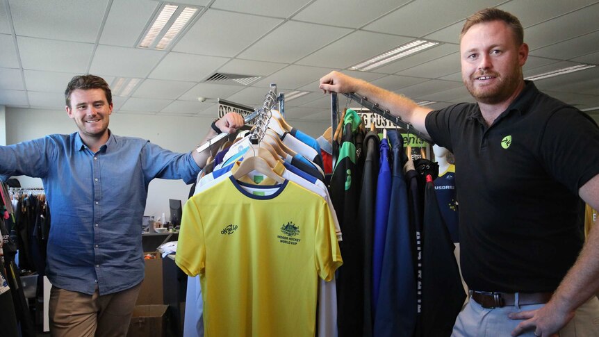 Employer Mick Spencer and veteran Kris Milne at On The Go sportswear in Canberra.