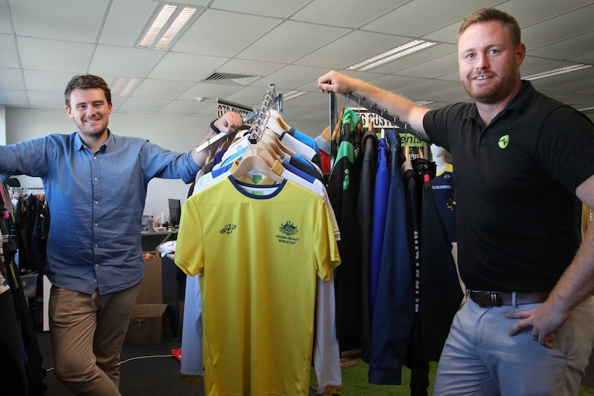 Employer Mick Spencer and veteran Kris Milne at On The Go sportswear in Canberra.