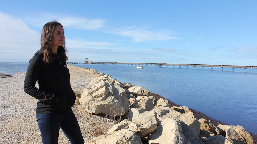 Marine Restoration Coordinator Anita Nedosyko looking out over the ocean to where the reef is being constructed.