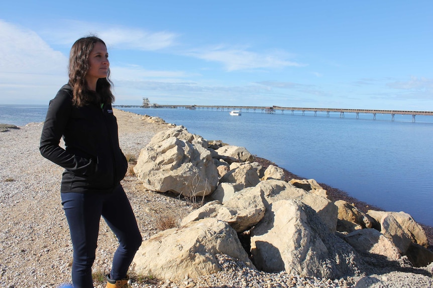 Marine Restoration Coordinator Anita Nedosyko looking out over the ocean to where the reef is being constructed.