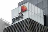 The PwC logo is shown on an office building.