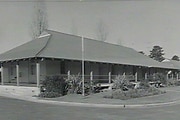 A black and white image of a school for boys.