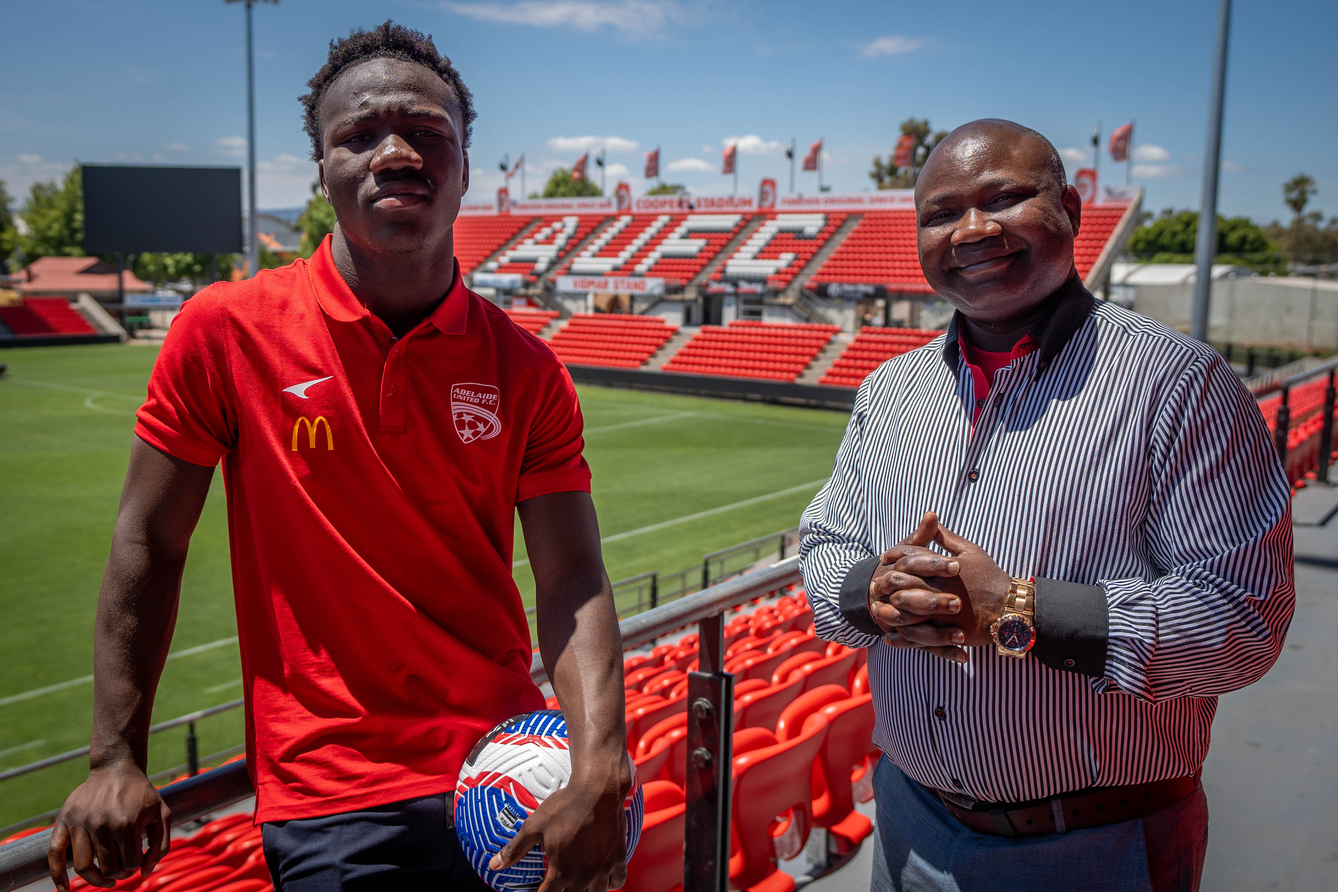 Soccer player Nestory Irankunda with father Gideon at Hindmarsh Stadium.