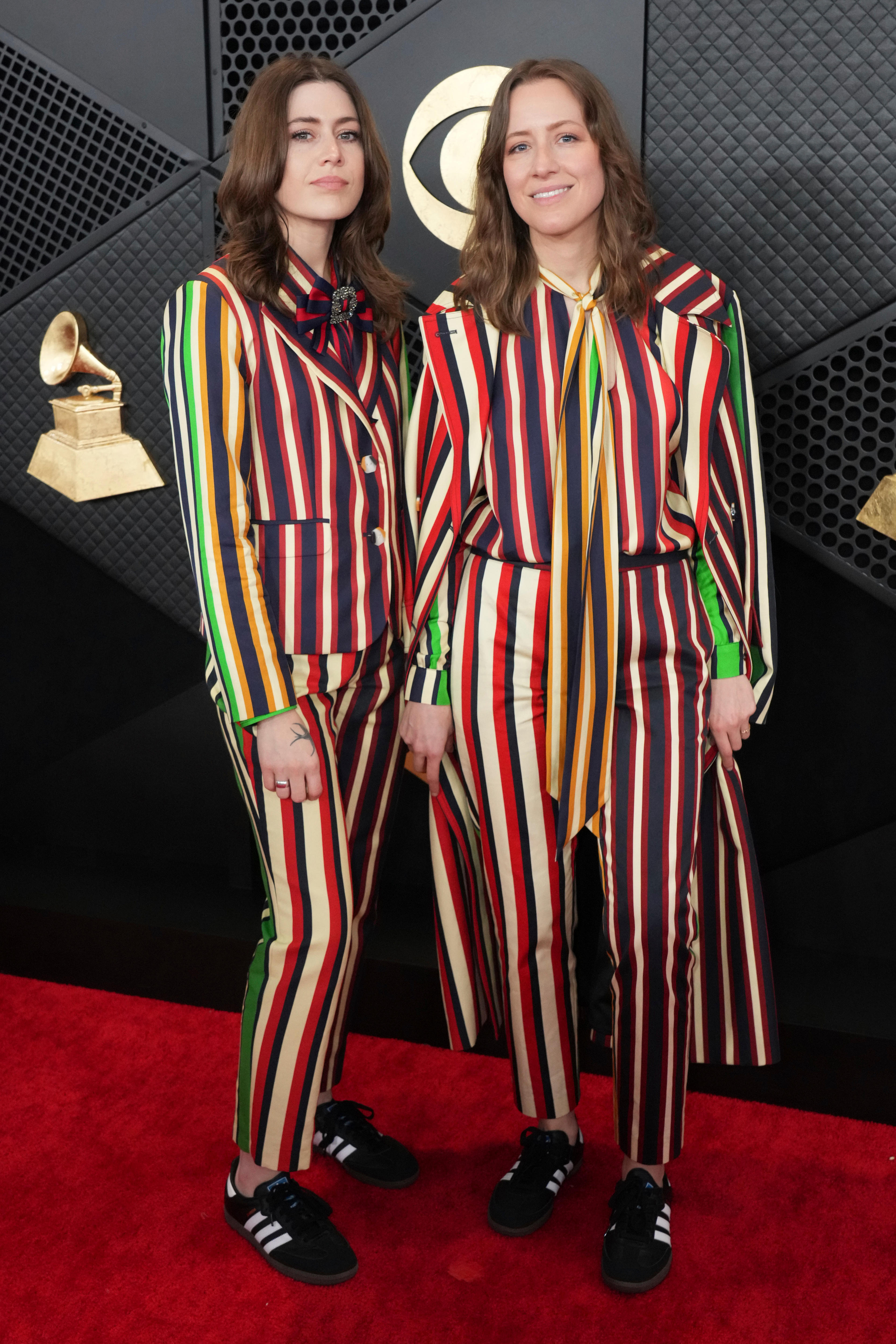 Megan and Rebecca Lovell wearing multi-coloured stripey suits