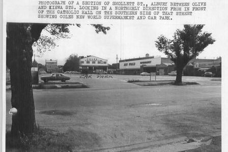 A black and white photo, with typed annotations, showing a street in a country town.