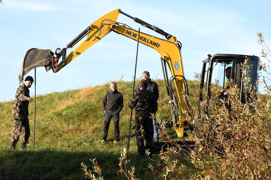 Slovenian soldiers build obstacles on the Slovenian-Croatian border