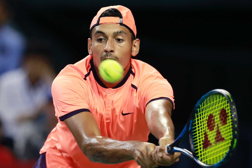 Tokyo victory ... Nick Kyrgios plays a backhand return against David Goffin