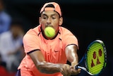 Kyrgios stretches for a backhand at Japan Open