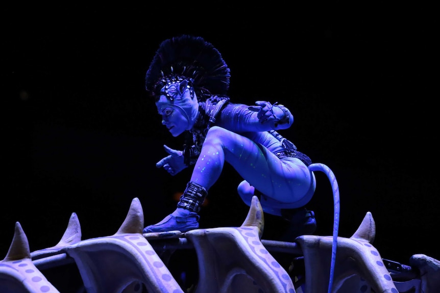 Peter Kismartoni crouching in costume in Toruk.