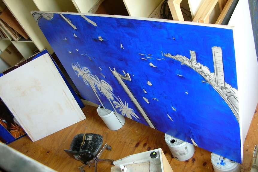 A shot from above of a blue painting in progress of a harbour with palm trees that haven't  been painted yet
