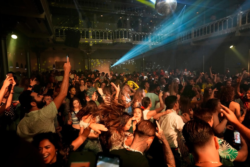 People dance in a converted church in Amsterdam.