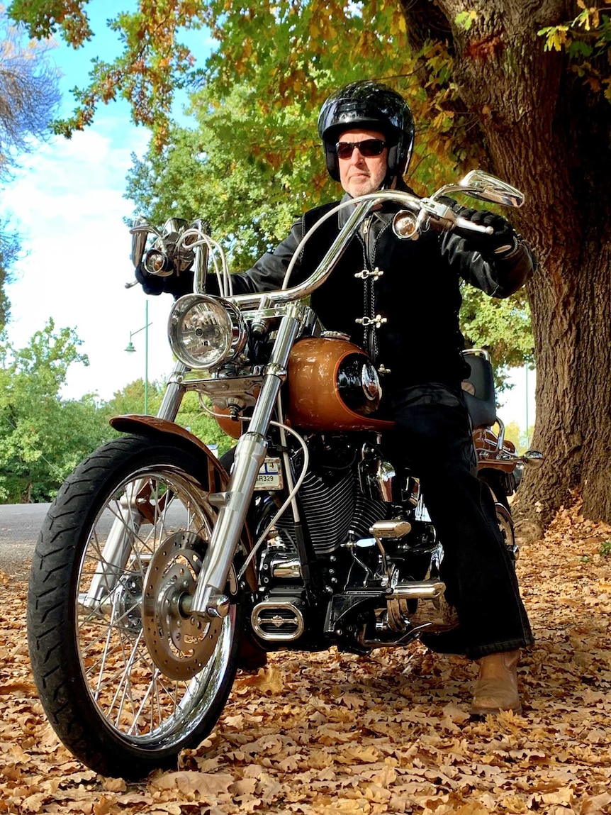 Nationals candidate rides a harley davidson motorbike during his Indi election campaign