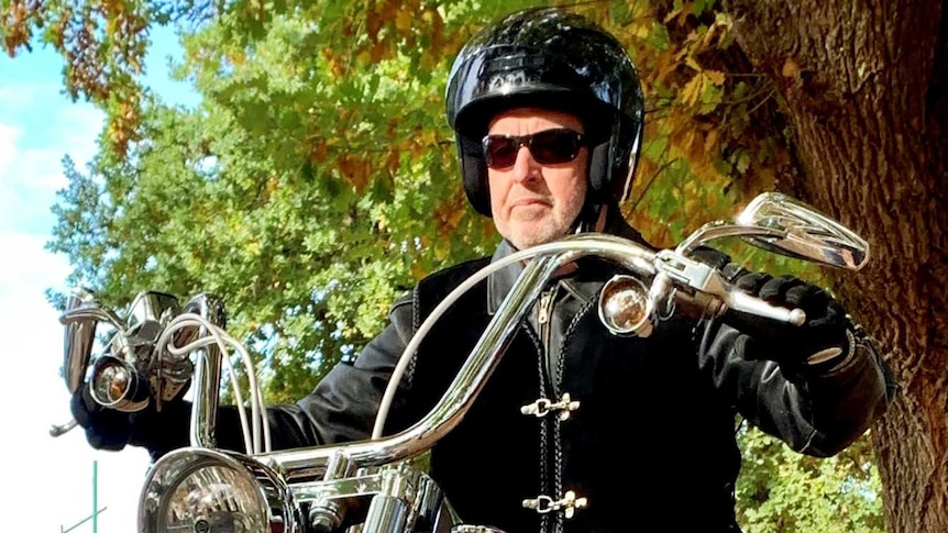 Nationals candidate rides a harley davidson motorbike during his Indi election campaign