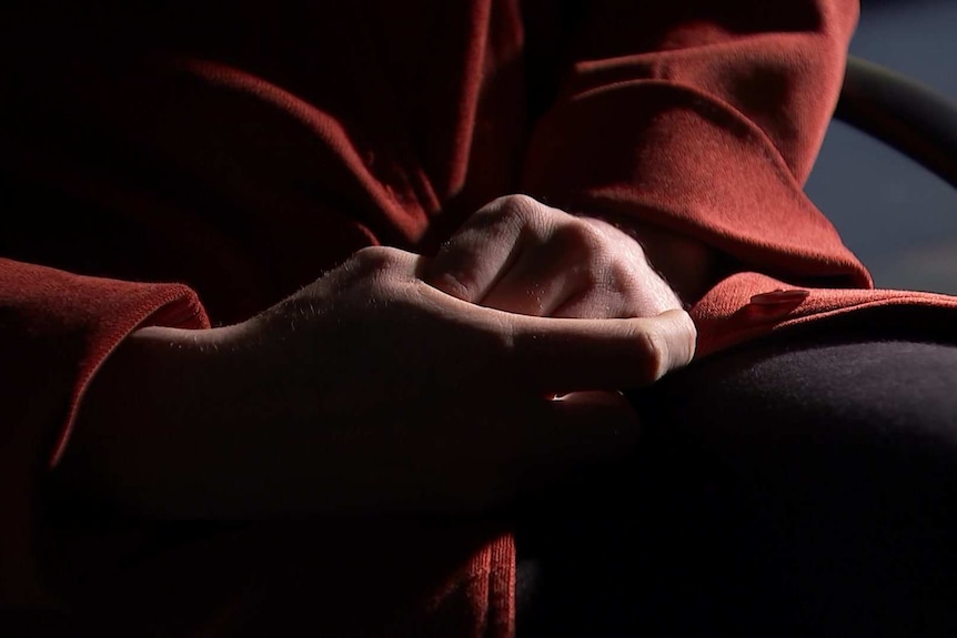 A woman's hands on her lap.