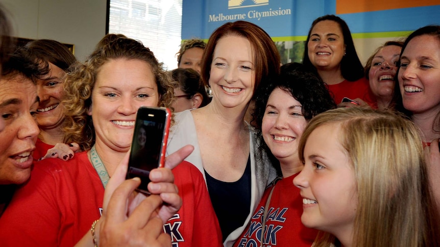 Julia Gillard takes part in a group photo