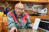 Roger Gee at a desk.