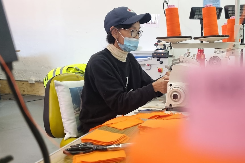 Thi Le makes high-visibility vests and hospital 'scrubs' for social enterprise Assembled Threads.