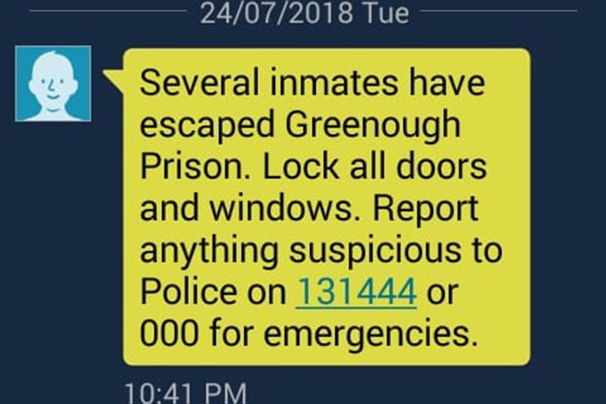 A screenshot of a text message warning of escaped prisoners