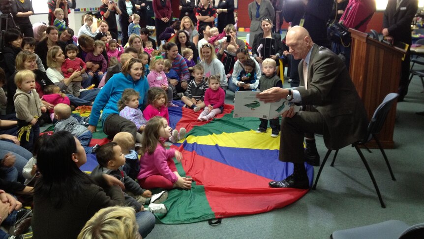 Federal Education Minister Peter Garrett reads to students at a Primary School.