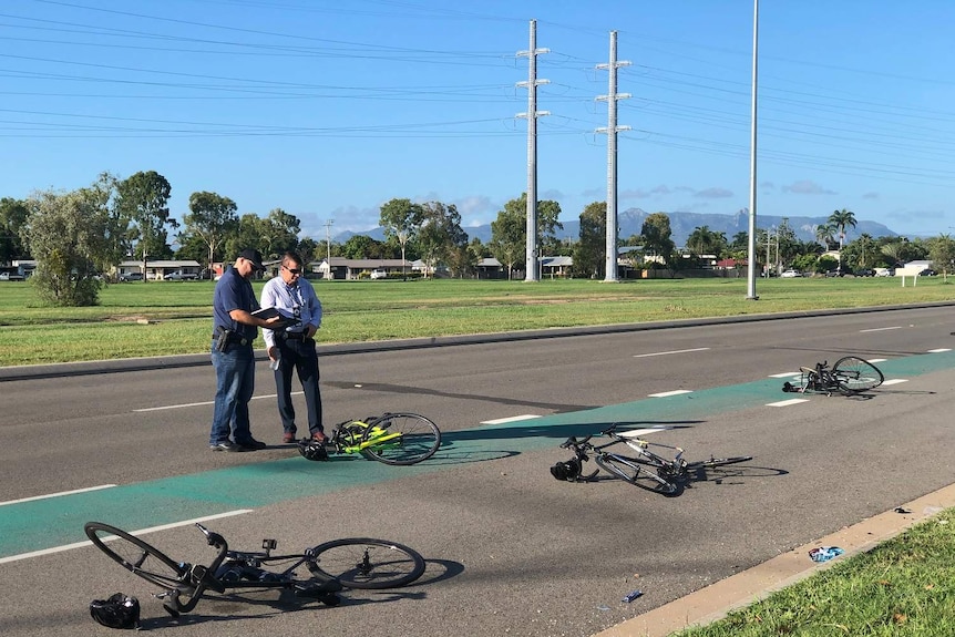 Detectives examine bikes crashed on the ground at Townsville.