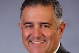 Telmo Languiller smiles at the camera in a portrait shot supplied by the Parliament of Victoria.