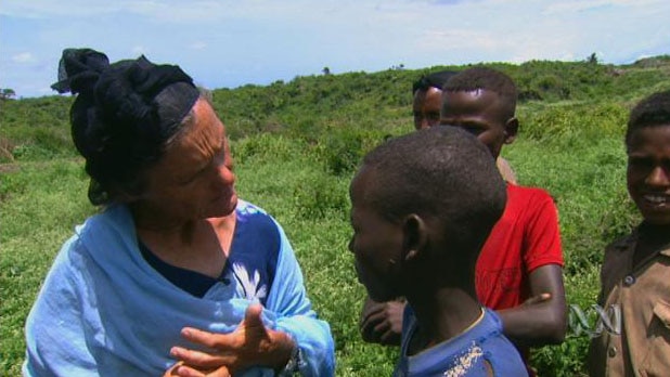 Ethiopian woman speaks to Ethiopian boy
