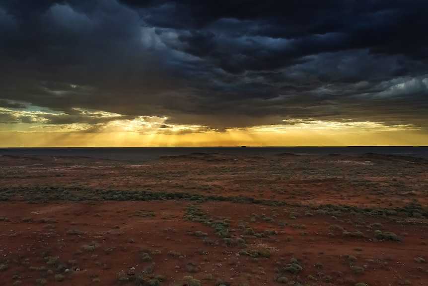 sunset with a storm in the outback