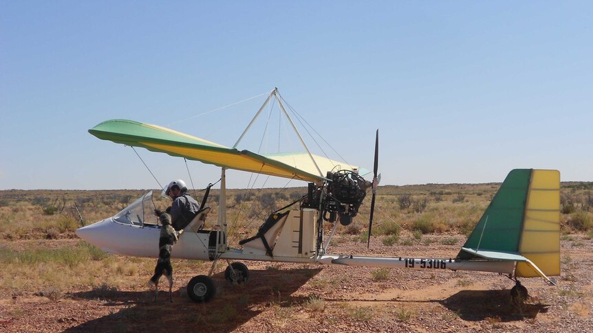 Patrick Tully in his plane at Cluny Station near Bedourie