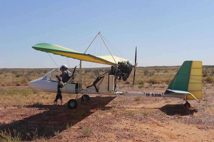 Patrick Tully in his plane at Cluny Station near Bedourie