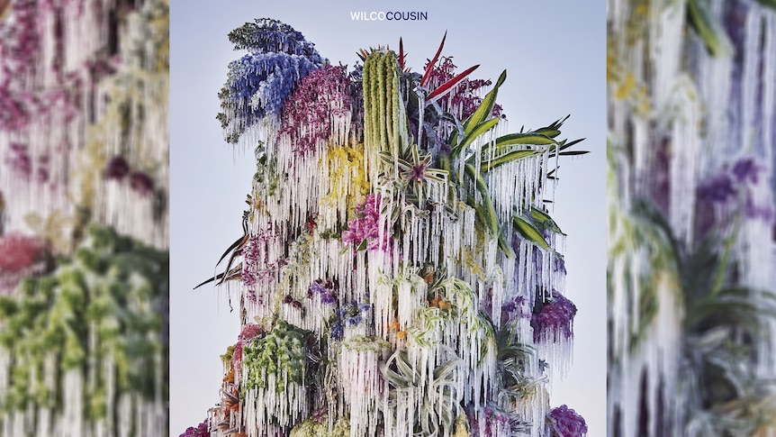 Cover art for Wilco's 2023 album Cousin showing icicles frozen on a colourful bouquet of flowers 