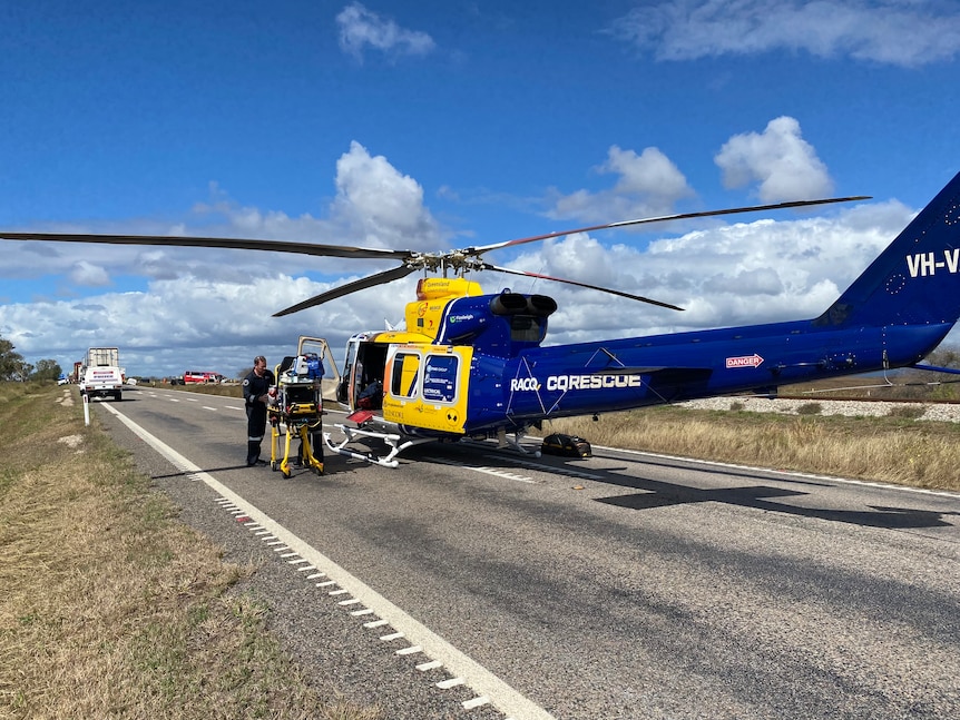 A rescue helicopter parked on a road 