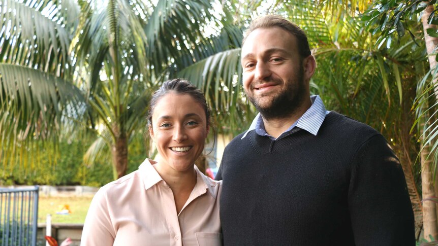 Jacqueline and Jonnie Hoy smiled for the camera in their backyard