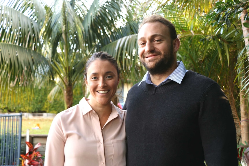 Jacqueline and Jonnie Hoy smiled for the camera in their backyard