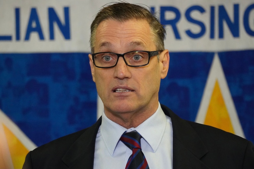 A head and shoulder shot of Australian Nursing Federation WA state secretary Mark Olson during a media conference.