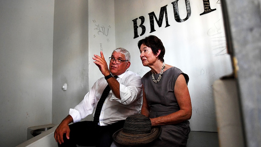 Commissioner Mick Gooda and Margaret White sit in a cell at the Don Dale Youth Detention Centre