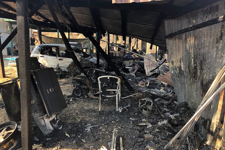 Destroyed shed and car at Mount Larcom in central Queensland after bushfires.