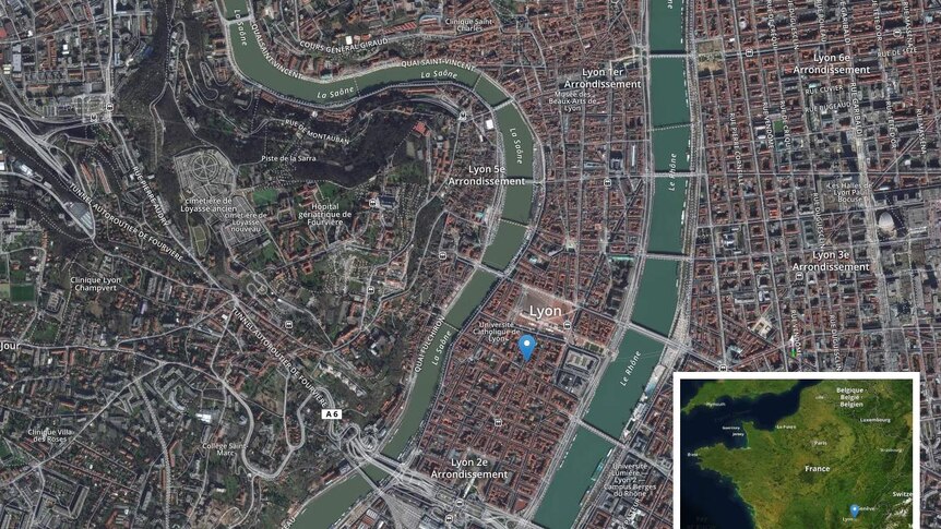 You see an aerial satellite map of Lyon with an arrow pointing to the attempted bombing, with an inset image of France.