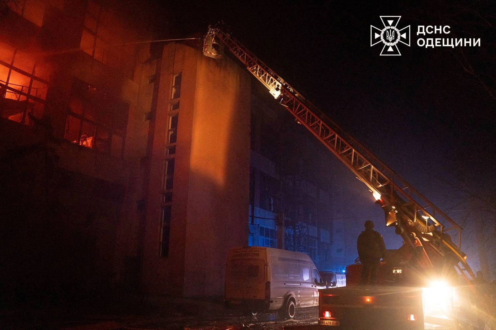 Firefighters try to put out a fire in a building in Odesa.