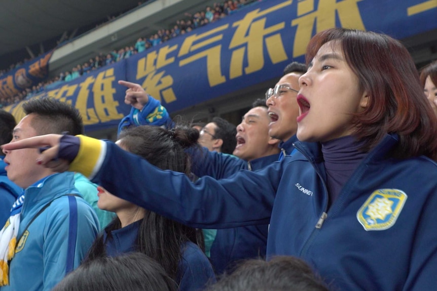 A Jiangsu Suning fan yells during a Chinese Super League match in Nanjing, China.