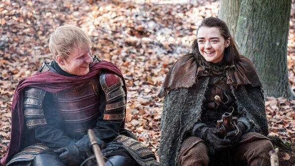 Ed Sheeran sits next to Masie Williams in Game of Thrones scene.