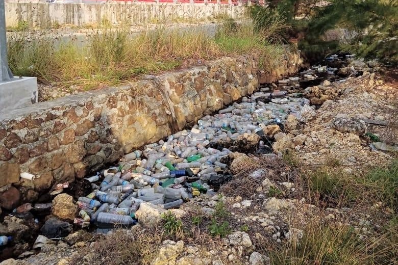 plastic bottles in a river