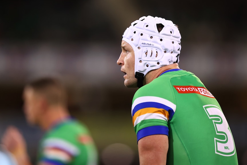A Canberra Raiders NRL players looks on during a match.
