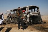 Pakistan soldier guards site of bus attack