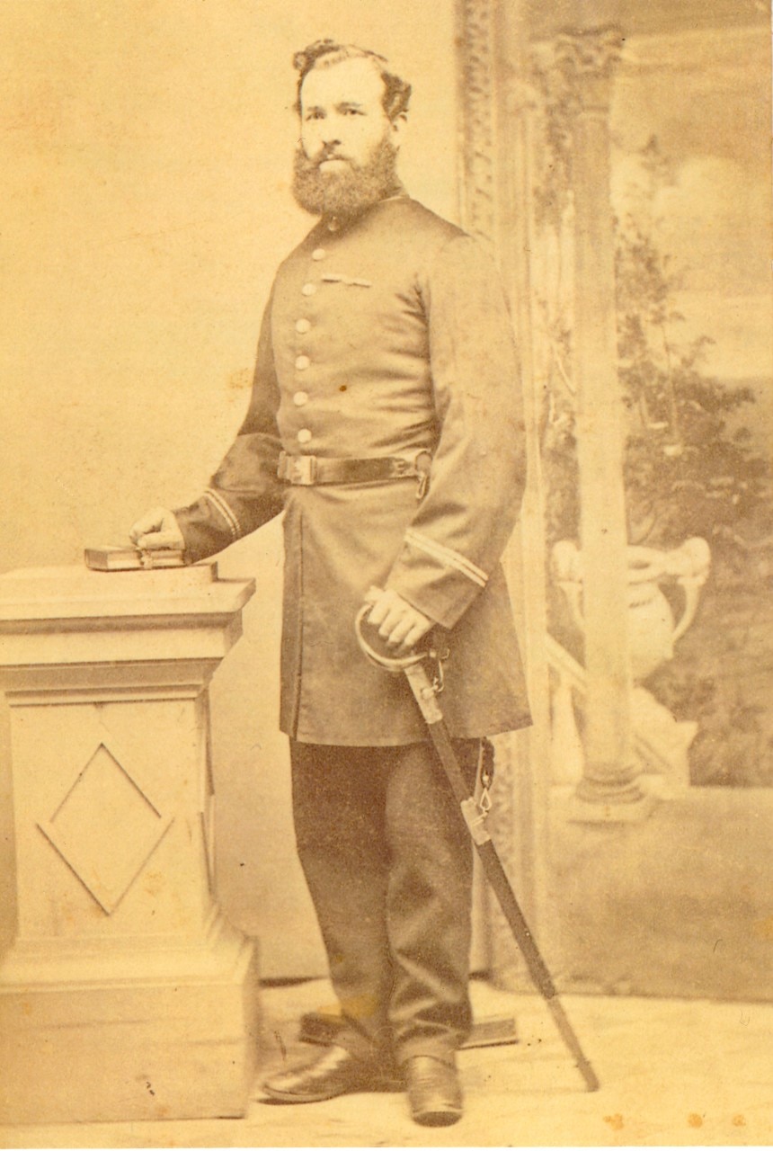 A sepia photo of a man in a uniform.